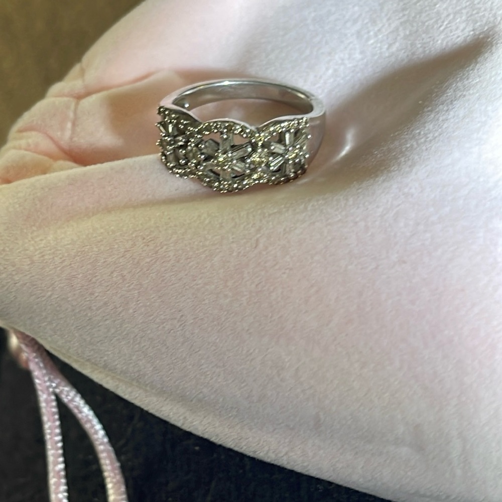 Diamond ring set in sterling silver. Size 8